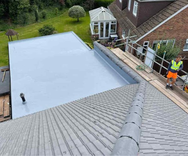 This is a photo of a newly installed hip roof, with a combined liquid covered flat roof. Work carried out by WCT Roofing Long Buckby