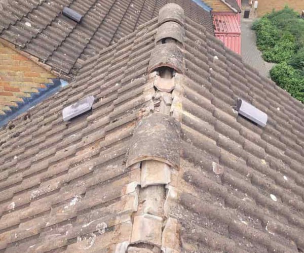 This is a photo if a roof ridge which has missing tiles. The ridge tiles are being replaced by WCT Roofing Long Buckby